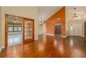 Open-concept living space with hardwood floors and stylish lighting at 7423 Elsworth Ct, Orlando, FL 32819
