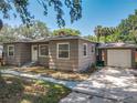 Well-maintained exterior with attached garage and walkway to the front door at 810 Catalina Dr, Sanford, FL 32771