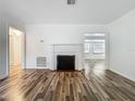 Bright living room with fireplace and hardwood flooring at 810 Catalina Dr, Sanford, FL 32771