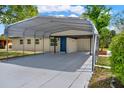 A house showing a long carport running from the street to the front door at 1805 Knox Ave, Sanford, FL 32771