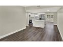 Open-concept living space featuring new floors, updated kitchen, and plenty of natural light at 1805 Knox Ave, Sanford, FL 32771