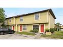 Townhome with neat landscaping, colorful doors, and convenient parking at 3251 Oak Lake Pl # 135, Winter Park, FL 32792