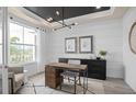 Modern office with stylish light fixture, desk, and storage at 4619 Flagstaff Ct, Orlando, FL 32820