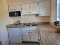 Functional kitchen featuring laminate countertops and practical appliances at 5505 Hernandes Dr # 118, Orlando, FL 32808