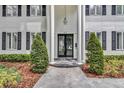Close-up of the entrance, featuring a glass double door framed by white columns at 613 Daniels Ave, Orlando, FL 32801