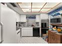 Functional kitchen with appliances, ample counter space and unique lighting at 6301 Parson Brown Dr, Orlando, FL 32819