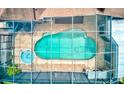 Aerial view of a screened in pool with attached spa at 677 Cheoy Lee Cir, Winter Springs, FL 32708