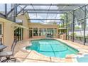 Enclosed pool area featuring brick patio, in-ground pool and spa at 677 Cheoy Lee Cir, Winter Springs, FL 32708