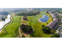 Scenic aerial view of a community located on a pristine golf course with mature landscaping at 9423 Myrtle Creek Ln # 510, Orlando, FL 32832