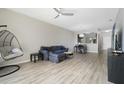 Inviting living area with hardwood floors, ceiling fan, and modern décor at 9423 Myrtle Creek Ln # 510, Orlando, FL 32832