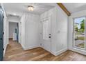 Bright entryway featuring wood look floors and a decorative glass front door at 1831 W Clinton Dr, St Cloud, FL 34769