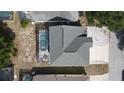 Aerial view of a home with a backyard featuring a screened-in swimming pool and patio at 339 Sigmund Loop, Davenport, FL 33837