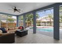 Relaxing screened-in patio with comfortable seating and views of the pool at 4353 Steed Ter, Winter Park, FL 32792