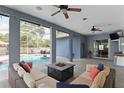 Inviting covered patio features an outdoor seating area, TV, and kitchenette at 4353 Steed Ter, Winter Park, FL 32792