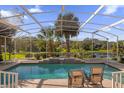 Enjoy the outdoor pool area complete with lush landscaping and a screened-in lanai at 5213 Overview Ct, Orlando, FL 32819