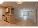 Spacious living area with tile flooring, neutral walls, and ample natural light at 6506 Swissco Dr # 1317, Orlando, FL 32822