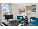 This home office is complete with stylish decor, modern desk, and bright natural light at 1218 Alstonia Ln, Mount Dora, FL 32757
