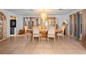 Bright dining room features tile floors, chandelier, and furniture for formal entertaining at 1430 Clarks Summit Ct, Orlando, FL 32828