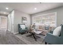 Comfortable living room with luxury flooring and large window provides plenty of natural light at 2113 Winnetka Ct, Orlando, FL 32818