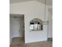 View into kitchen with white cabinets, breakfast bar, and kitchen dining area at 236 Ridge View Dr, Davenport, FL 33837