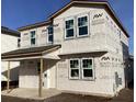 New home construction showing windows and covered porch during the building process at 2395 Zuni Road, St Cloud, FL 34771