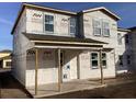 New home construction showing the side of the house with windows and covered porch at 2395 Zuni Road, St Cloud, FL 34771