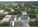 An aerial view of a home nestled among lush greenery in a quiet neighborhood at 2644 Sw 162 Nd Street Rd, Ocala, FL 34473
