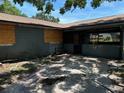 Exterior view of the side of the home, which shows that it needs some repairs at 4302 Seybold Ave, Orlando, FL 32808