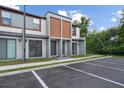 Modern townhomes feature a neutral color palette, sleek lines, and reserved parking at 8802 Positivity Dr, Kissimmee, FL 34747