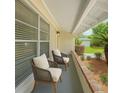 Inviting front porch featuring comfortable seating, ideal for relaxation and enjoying the outdoors at 1209 Stevens Ave, Orlando, FL 32806