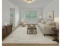 Comfortable living room with neutral tones, ample seating, and a serene atmosphere at 1209 Stevens Ave, Orlando, FL 32806