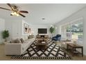 Bright living room with a large window, stylish furnishings, and modern decor at 1209 Stevens Ave, Orlando, FL 32806