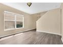Living room featuring a window and staircase at 1556 Sherbourne St, Winter Garden, FL 34787