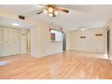 Bright living room featuring wood floors, neutral paint and generous closet space at 190 Hickory Woods Ct # 12B, Deltona, FL 32725