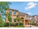 Charming two-story home with meticulously landscaped front yard and an attached two car garage at 2311 Victoria Dr, Davenport, FL 33837