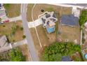 Aerial view of a single-Gathering home with solar panels and screened-in pool at 2602 Adelia Blvd, Deltona, FL 32725