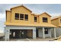 Exterior view of a home under construction with a concrete block first story and plywood second story at 2672 Great Heron Ave, St Cloud, FL 34773