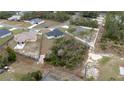 A serene aerial view showcasing the home's placement within a tranquil wooded neighborhood at 2824 Sw 166Th Ln, Ocala, FL 34473