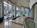 Spacious lobby with a water feature, large windows, and modern architecture at 322 E Central Blvd # 908, Orlando, FL 32801