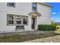 Welcoming home entrance with manicured landscaping and bench seating at 3661 Brighton Park Cir, Orlando, FL 32812