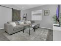 Cozy living room with a comfortable sectional sofa and a rustic sliding barn door at 5345 Sunrise Blvd, Orlando, FL 32803
