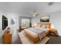 Cozy bedroom with a comfortable bed, soft lighting, and serene decor at 5413 River Rock Rd, Lakeland, FL 33809