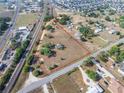 Large property with a mix of clearings and trees, bordered by a road and railway, offering great potential at 2300 Olsen Rd, Haines City, FL 33844