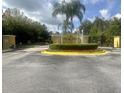 Community entrance with decorative water feature and 'Encantada' signage for a welcoming arrival at 3020 Red Ginger Rd, Kissimmee, FL 34747