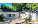 Charming home featuring a well-maintained lawn, a garage, and a brick-paved driveway at 30542 Hoylake St, Sorrento, FL 32776