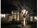 Eye-level nighttime view of a home's front porch with potted plants at 320 Remington Dr, Oviedo, FL 32765