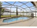 A screened-in pool with a safety fence offers a secure and relaxing outdoor space at 350 Black Springs Ln, Winter Garden, FL 34787