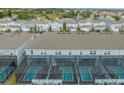 An aerial view showcasing a community's screened-in pools, each offering privacy and relaxation at 3838 Lana Ave, Davenport, FL 33897