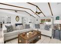 Spacious living room with beamed ceilings, neutral furniture and decor, and an open layout perfect for entertaining at 4646 Old Road 37, Lakeland, FL 33813