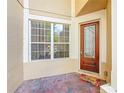 Charming front porch with brick pavers and a decorative welcome mat by the front door at 6240 Miramonte Dr # 102, Orlando, FL 32835